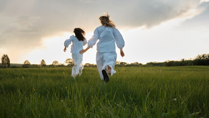 Women Running Along Meadow