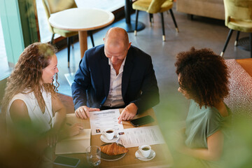 Diverse HR manager discussing resumes