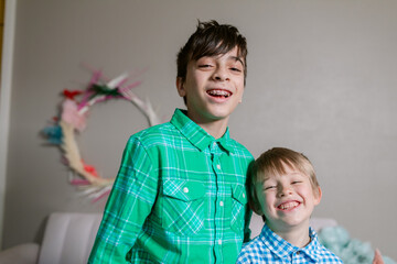 Brothers laughing indoor at christmas