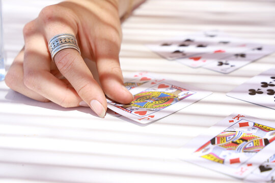 Hand Of Woman Playing Card Game