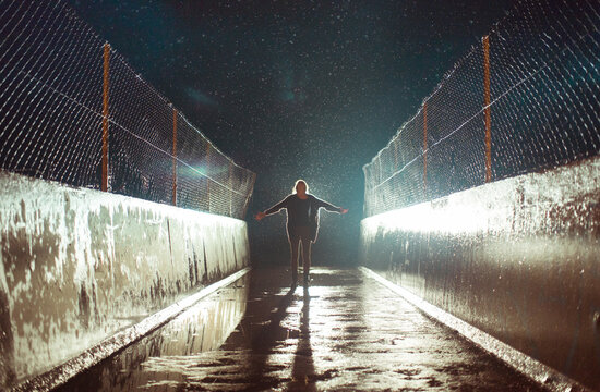 Happy Woman Feeling The Rain At Night