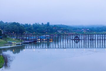 Fototapeta premium View of nature on the old wooden bridge in the morning in Thailand.
