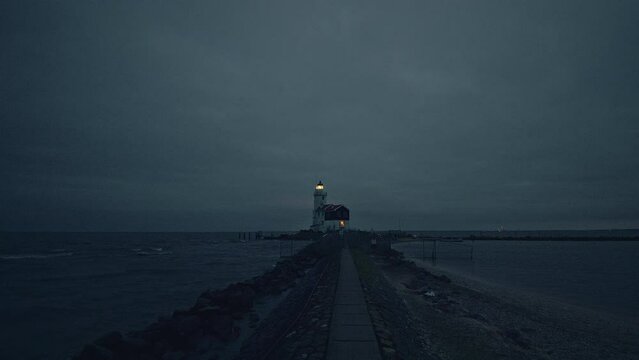 POV walking footage of the Paard van Marken lighthouse in the peninsula of Marken, North-Holland province, the Netherlands.