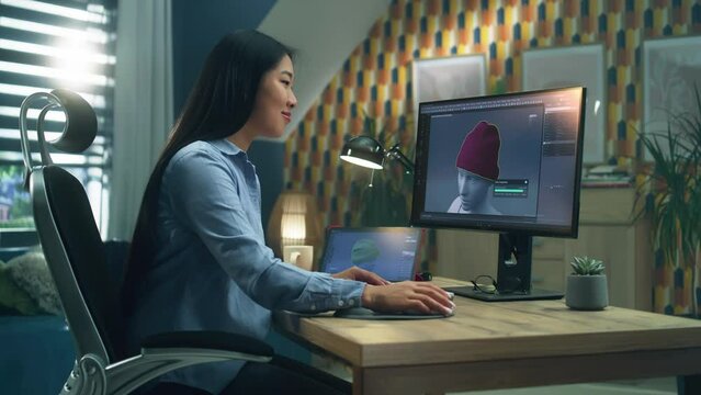 Female asian 3D designer having remote work on 3D modeling and creating 3D visualization of clothes using pc with professional software and tablet computer