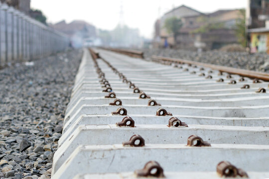 Railbed, substructure of a railroad, underlying the tracks. Selective focus