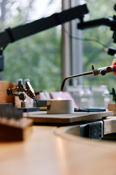 Jeweler using torch