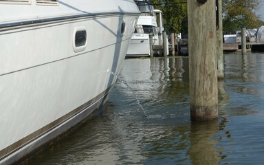 Fototapeta na wymiar boat on the dock ,luxury yacht pump out water to the lake, boat, 