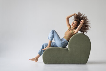 Beautiful young woman lying on a sofa