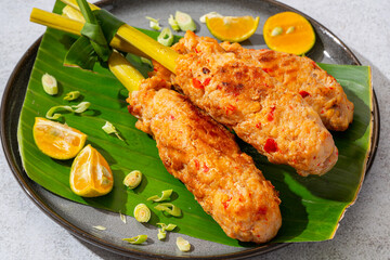 sate lilit is a satay variant in Indonesia, originating from Balinese cuisine. This satay is made from minced chicken and spiced minced meat is wound around lemongrass sticks then grilled on charcoal