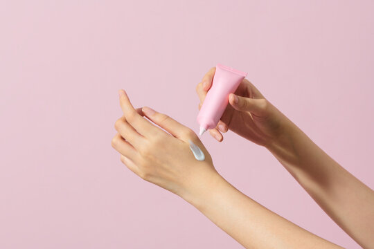 Young Woman Applying Moisturizing Lotion