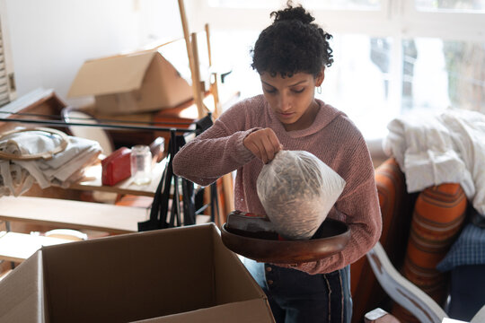 Woman Taking Things Out Of Box