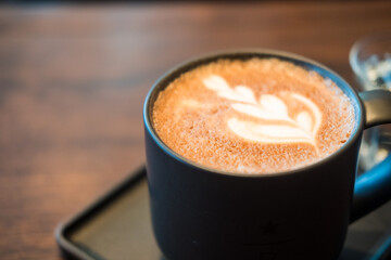 Hot mocha coffee. A cup of coffee with beautiful latte art. Close up