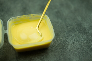 Cheddar cheese in box for deep fried french fries and snack