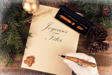 Santa Claus is writing a letter directly above. Flat lay for Christmas concept.