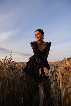 Stylish woman in dress spending time in rural area 