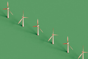 a row of pink wind turbines