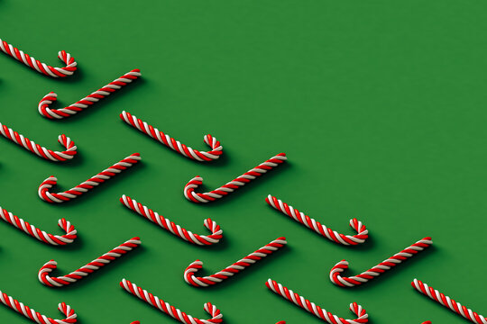 red and white candy cane on green background