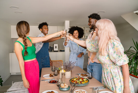 People Holding Glasses Together