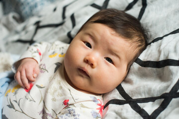 Cute alert baby looking at camera