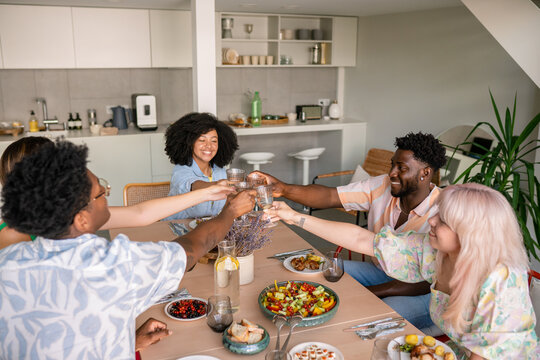 Friends Holding Wine Glasses For Cheers