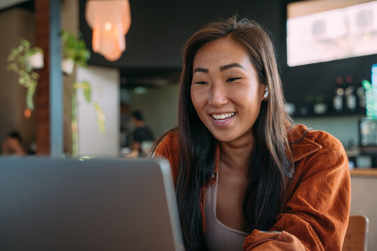 smart female working at cafe alone with computer