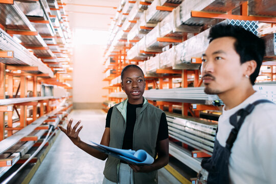 Man and Woman Working in Warehouse 