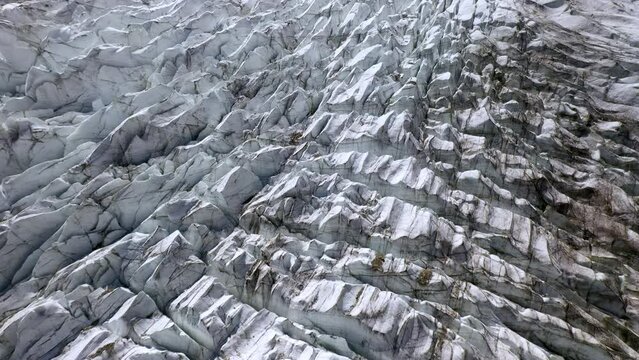 Drone shot starting downward and tilting up to reveal glacier at Fairy Meadows Pakistan, cinematic aerial shot