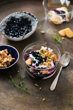 Parfait with yogurt, biscuit, granola and berries