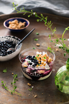 Parfait with yogurt, biscuit, granola and berries