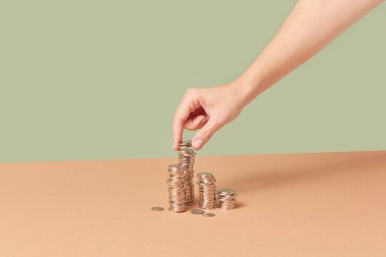 Cents being put in stacks by woman.