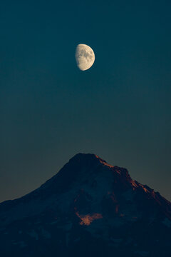 Moon Rises over A Mountain