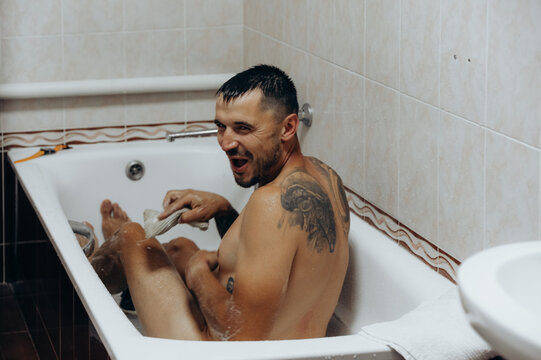 Happy Man Taking Bath At Home