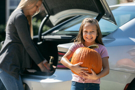 Taking Halloween Pumpkins From Car