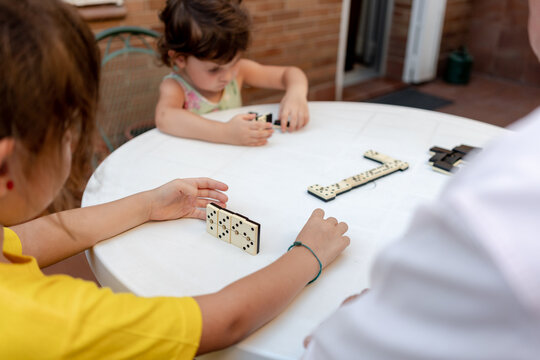 Family time playing domino with great grandfather