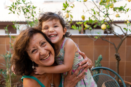 Playing with happy grandmother