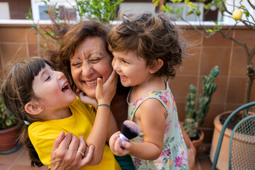 Playing with happy grandmother