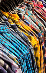  men shirts hanging on hangers in shop display