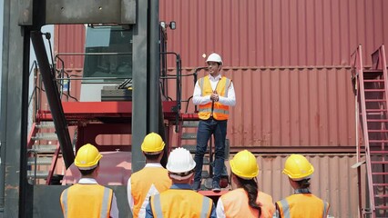 Workers gather to protest and expressed their displeasure at the cargo port with truck and container. Concept of movement, labor strike, work stoppage and revolution.
