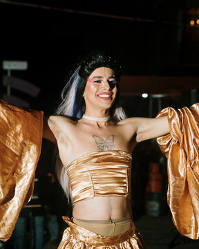 Latinx drag queen smiling after the show