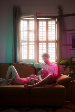 Surreal couple hangover on the sofa