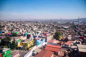 View of the Iztapalapa neighborhood in Mexico City from the Cablebús, an aerial tram, the gondola...