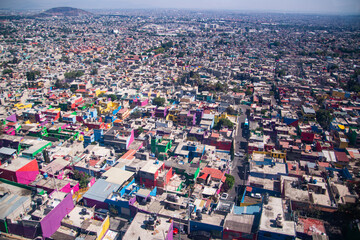 Obraz premium View of the Iztapalapa neighborhood in Mexico City from the Cablebús, an aerial tram, the gondola cable car that is part of the city s public transportation system.