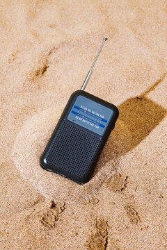 black radio on the beach