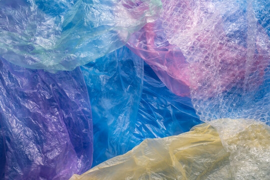 A lot of colourful plastic bags laying together