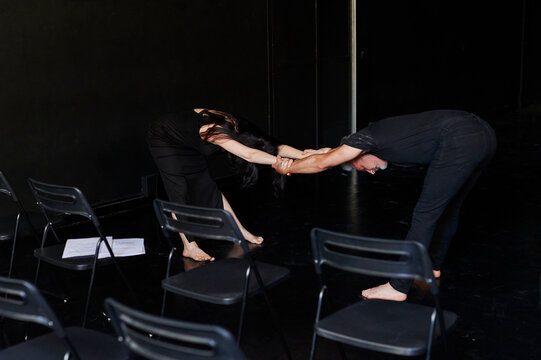 Mature modern dancers rehearsing together