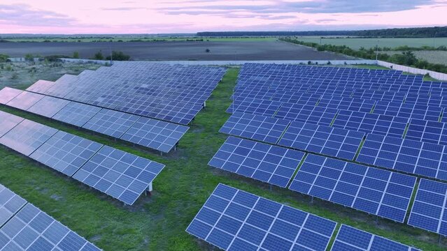 Solar panels angled optimally on solar farm - green energy production