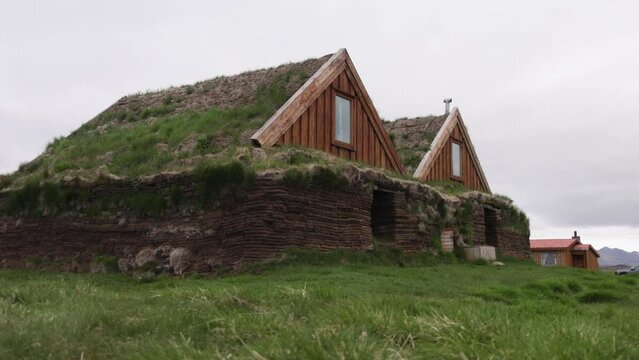 Turf houses and buildings in Iceland with gimbal moving forward.