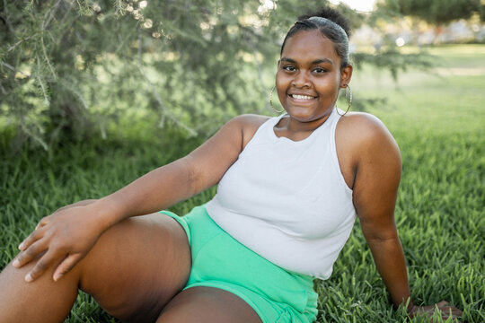 portrait of young black plus size woman in nature