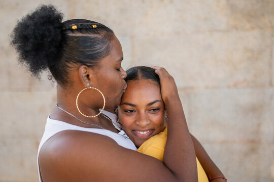 black women friends hugging