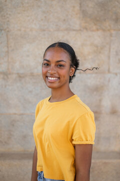 teenage black girl smiling outdoors